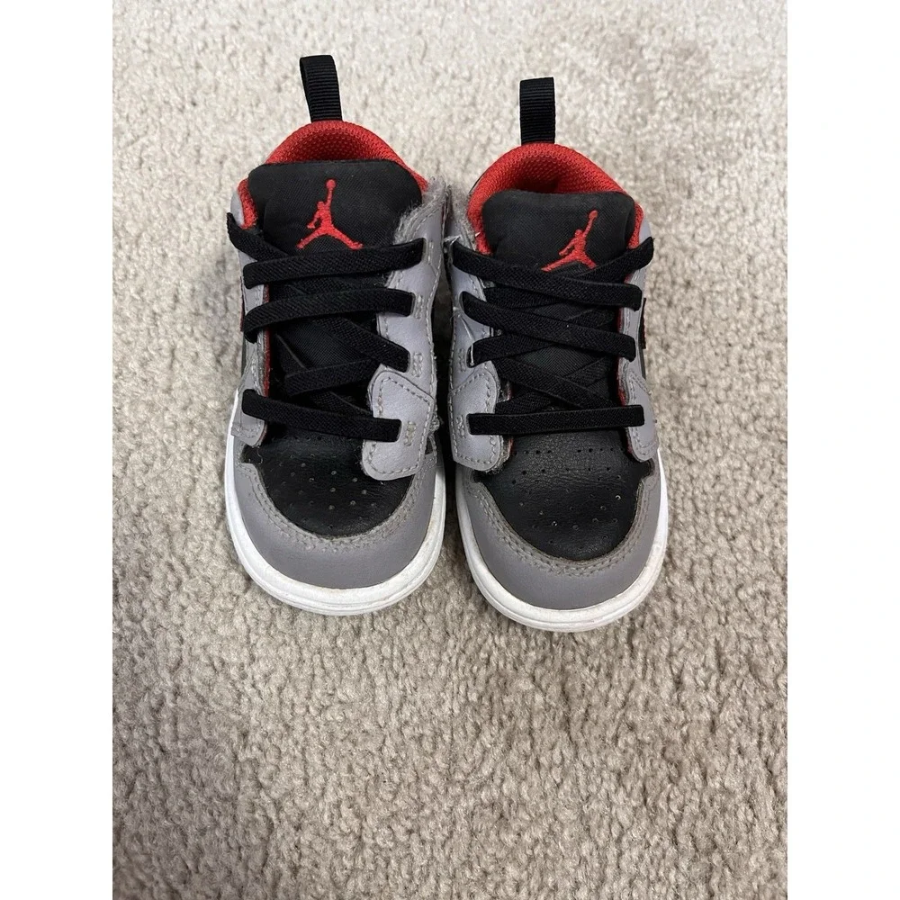 Air Jordan 1 Low Alt sneakers in a black, cement grey, and red colorway